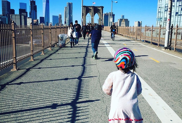 Girl scoots across the Brooklyn Bridge