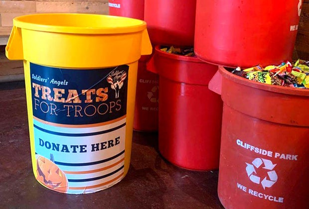 containers filled with candy for Halloween candy donations