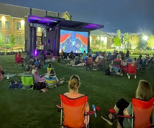 Everyone is invited to the Crabapple Market Green where families enjoy a free, family-friendly movie night. Photo courtesy of Crabapple Market