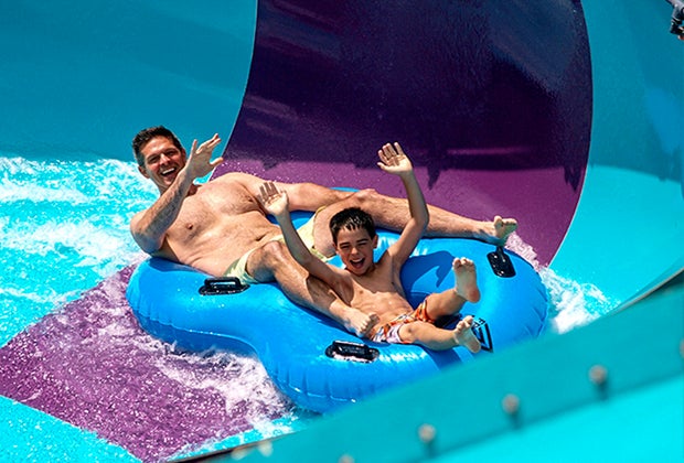 Image of father and sun on waterslide - Best summer day trips from CT