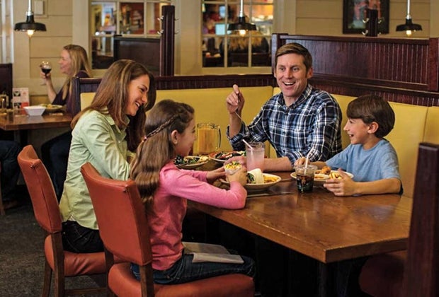 Image of family at a restaurant - Kids Eat Free