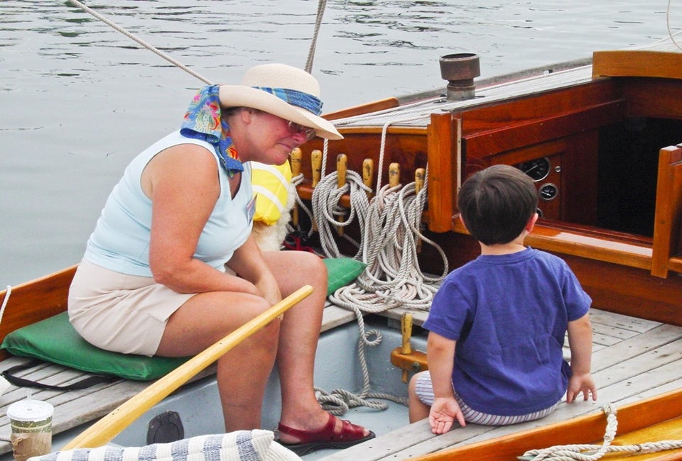 Kids get up close to some special classic boats in Salem. Photo courtesy of the  Antique & Classic Boat Festival