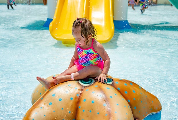 young toddler in a water park 