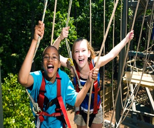 During certain times of the year, families can venture to Stone Mountain Park's SkyHike--an all-ages ropes adventure course.