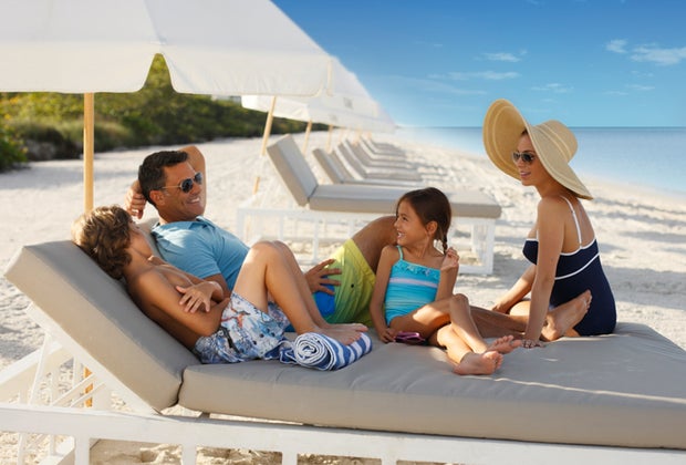 Naples Grande Beach Resort family on the beach