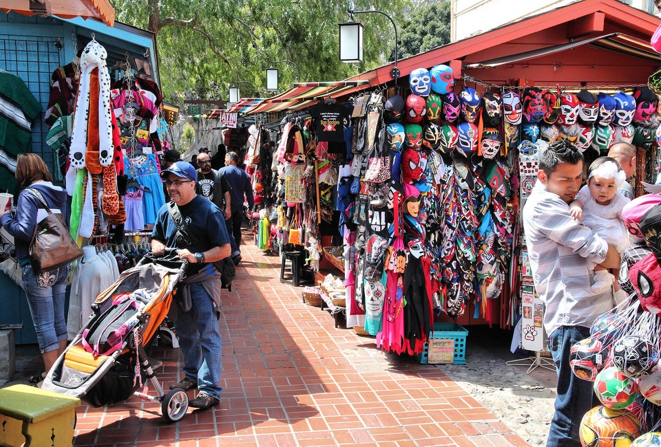 People bustle along Olvera Street