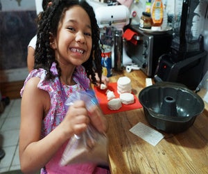 Put kids to work in the kitchen baking  family-favroite treats! Photo by Jody Mercier