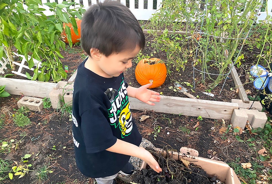 Just one kid composting can save 400 pounds of food waste a year. So yes, one kid can make a difference! Photo by Maureen Wilkey