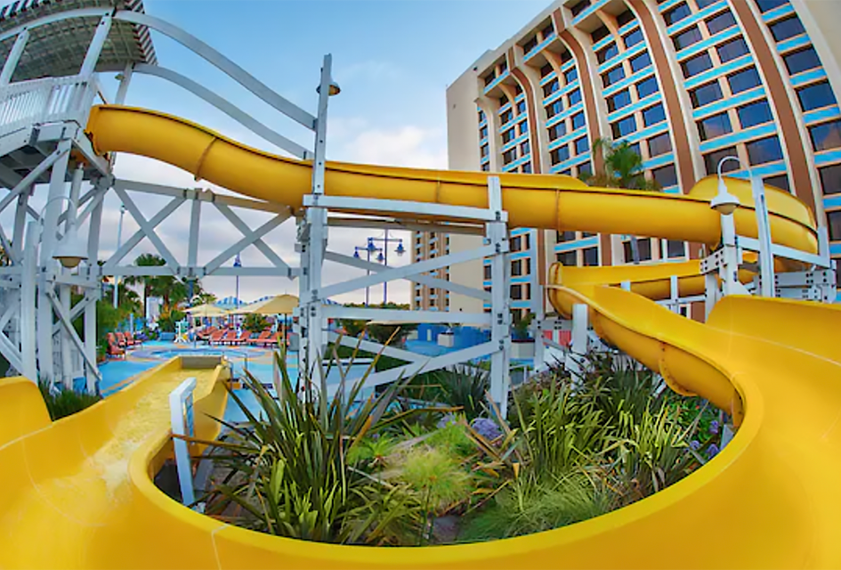 Twsit, turn, then plunge into refreshing waters with a wild ride down the water slide at Disney Paradise Piers Hotel. 