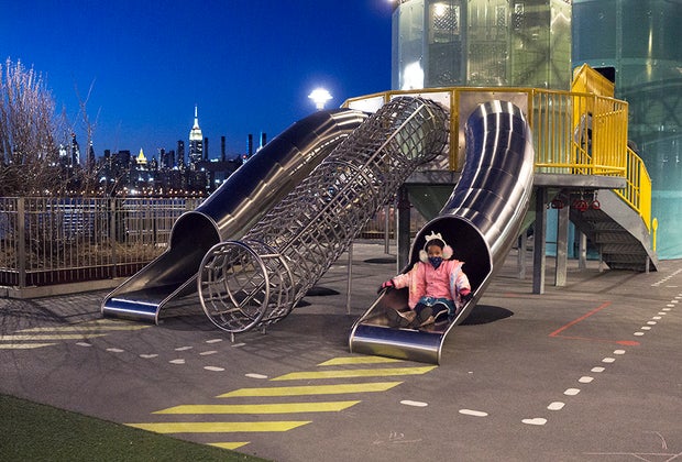 Girl on slide at domino park
