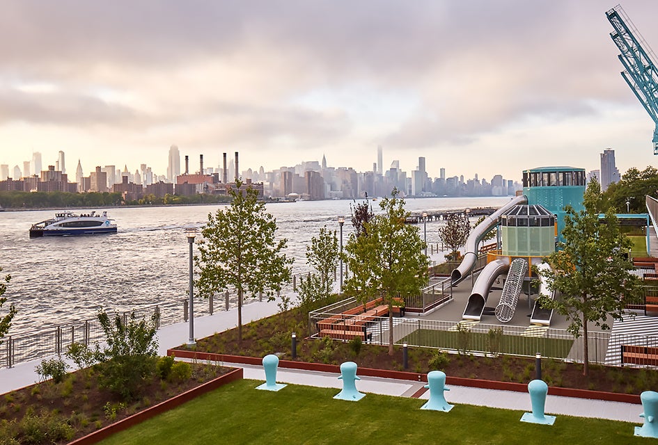 The waterfront park includes green space and playgrounds.