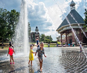Head to the Duluth Town Green Fountain for a romp through the refreshing splash pad. Photo courtesy Explore Gwinnett