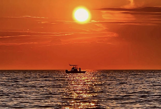 Photo of sunset on the ocean off Cape Cod.