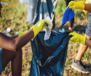 Cleaning up a local park is a great way to celebrate Earth Day. Photo courtesy of Canva