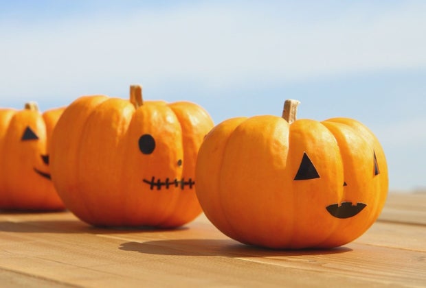 use black construction paper to decorate jaco o'lantern faces on pumpkins