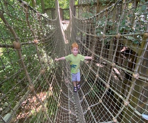 Toddlers can climb among the tree canopy at the Fernbank Forest WildWoods playground . Photo by Kristin Kneeland