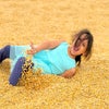 Kids love rolling around the barn full of corn at Fink’s Country Farm. Photo by the author