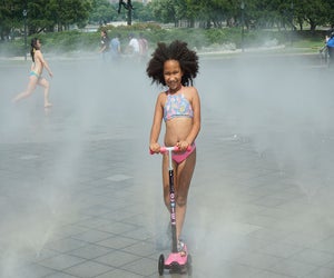 The kid-friendly splash pad at the Fountain of the Fairs is made even sweeter when the ice cream truck cruises by. 