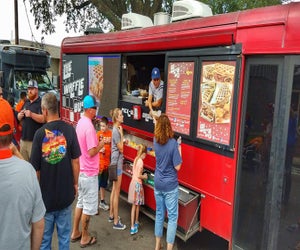 Enjoy eats from local food trucks and listen to live music at the annual Freight Train Food Truck Festival. Photo courtesy of Tomball Texan for Fun.