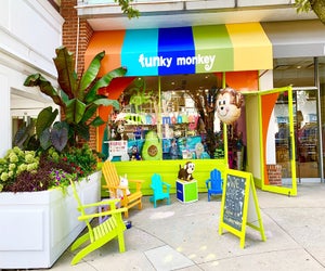 Funky Monkey meets customers outside its bright storefront for contactless curbside order pickup. Photo courtesy of Funky Monkey Toys & Books