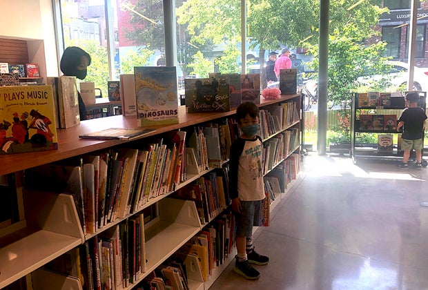 boy in the children's section at the greenpoint library