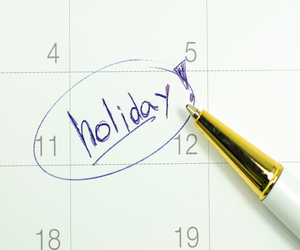 holiday written on a calendar with the date circled