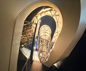 Math is all around you at MoMath, including on the spiral staircase that surrounds a parabola! 