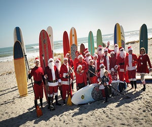 Hang 10 with lots of Santas at one of the oddest Orlando holiday events. Photo courtesy of Surfing Santas