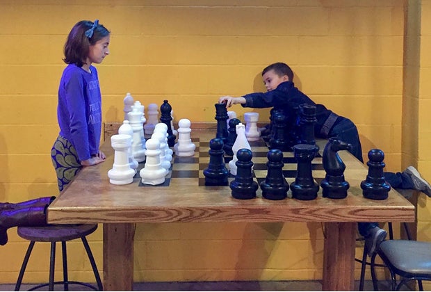 Image of children playing chess - Family-Friendly Breweries in Connecticut
