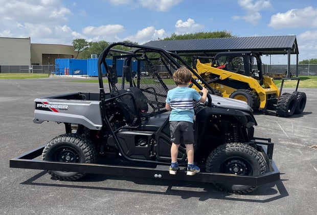 Vehicles at the front of the park are available for photo ops.