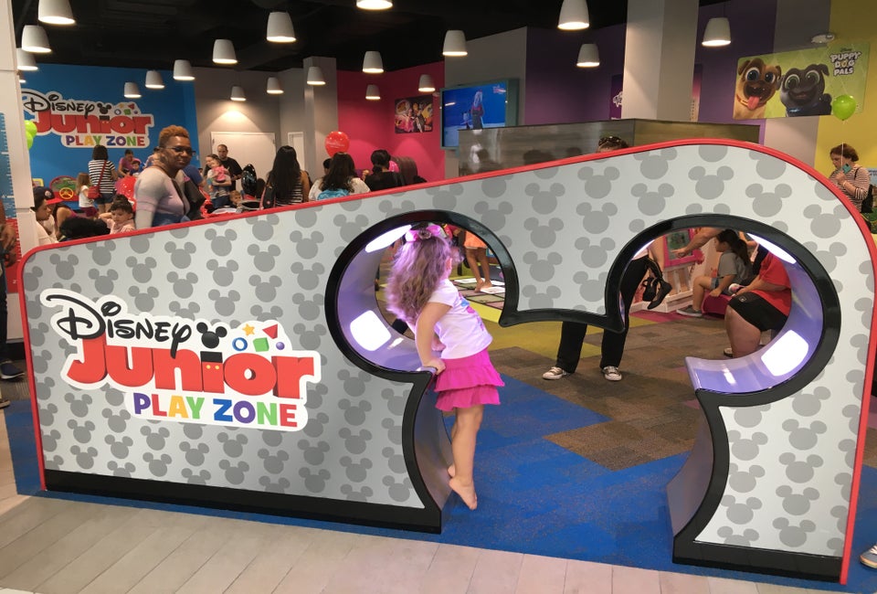 Kids can walk through a pair of Mickey ears to enter the play space. 