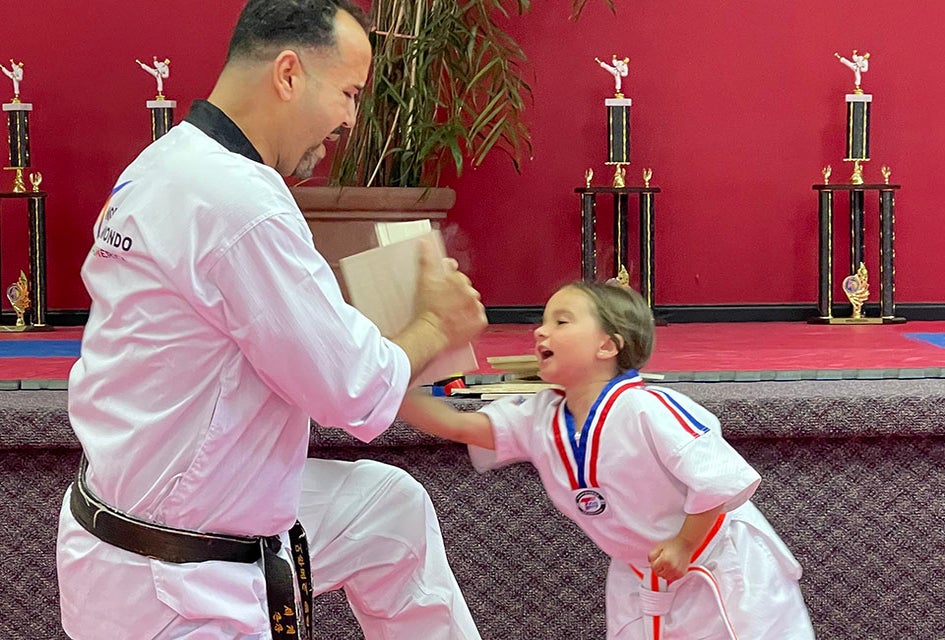 Break the board during a karate class at International Martial Arts.