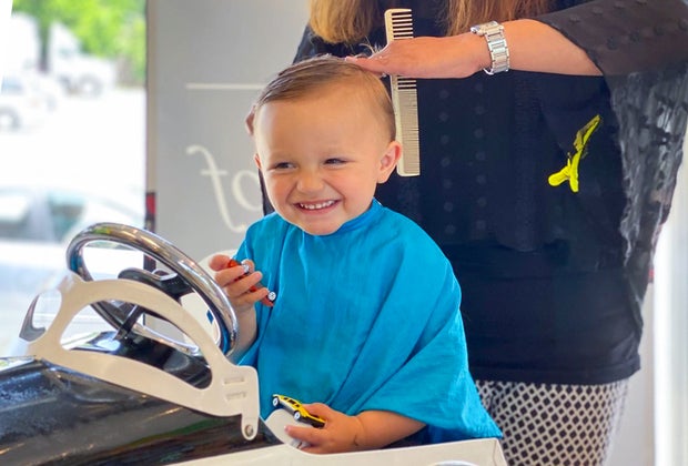 Salons specializing in baby and toddler haircuts often offer fun distractions.
