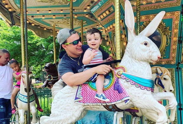 Photo of father and child on carousel - Visiting Lake Compound with Kids
