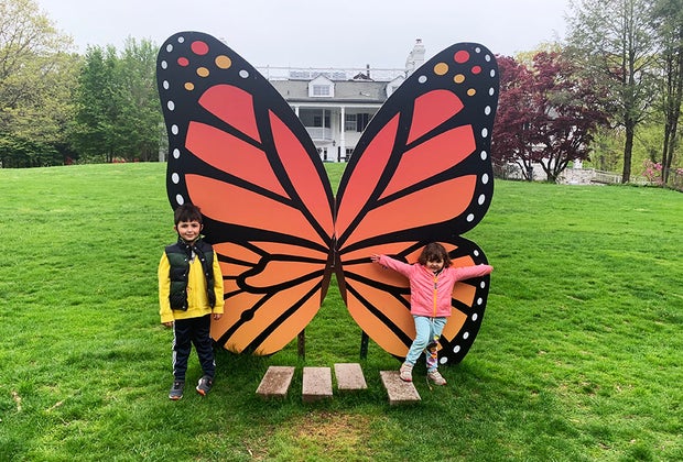 Kids posing with giant butterfly at Lasdon Park & Arboretum