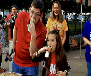 Indulge in a giant cannoli at the La Italia Fest.