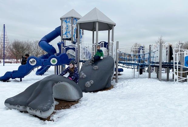 Kids on snowy playground at Liberty State Park