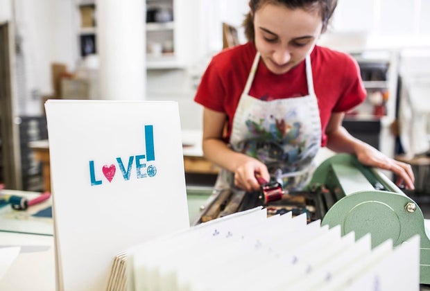 a girl doing an art project, one of the best teen and tween birthday party ideas