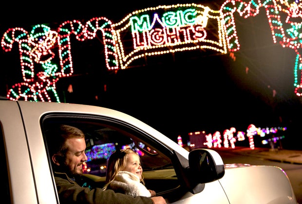 Girl and dad enjoy Magic of Lights Drive-thru