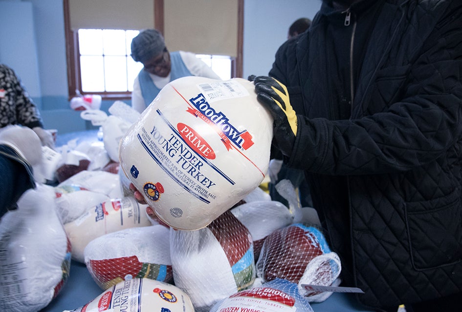 Many organizations throughout New York City are offering free turkey giveaways, plus full, hot Thanksgiving dinners this season. Photo by John McCarten for the New York City Council 