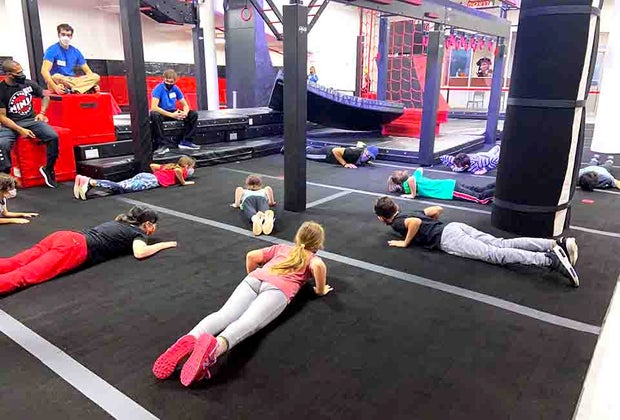 kids warm up for ninja class