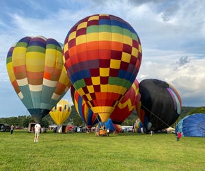 Watch the skies above for colorful hot air balloons, or drop in to the Warren County Farmers Fair Balloon Fest to take a tethered ride. Photo by Giulia Grotenhuis