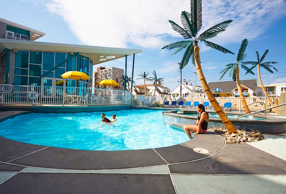 Take a dip in the pool at the Starlux, a family-friendly hotel in Wildwood, New Jersey. 