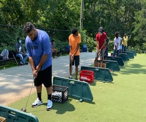At the Boys & Girls Club camp, activities include golf. Photo courtesy of the camp
