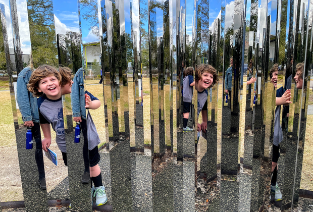 boy exploring the art at sculpture gardens in City Park, New Orleans