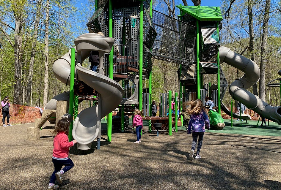 The towering new playground structure at Nomahegan Park packs tons of fun with its twisty slides, wobbly bridge, and tons of challenging climbing structures. 