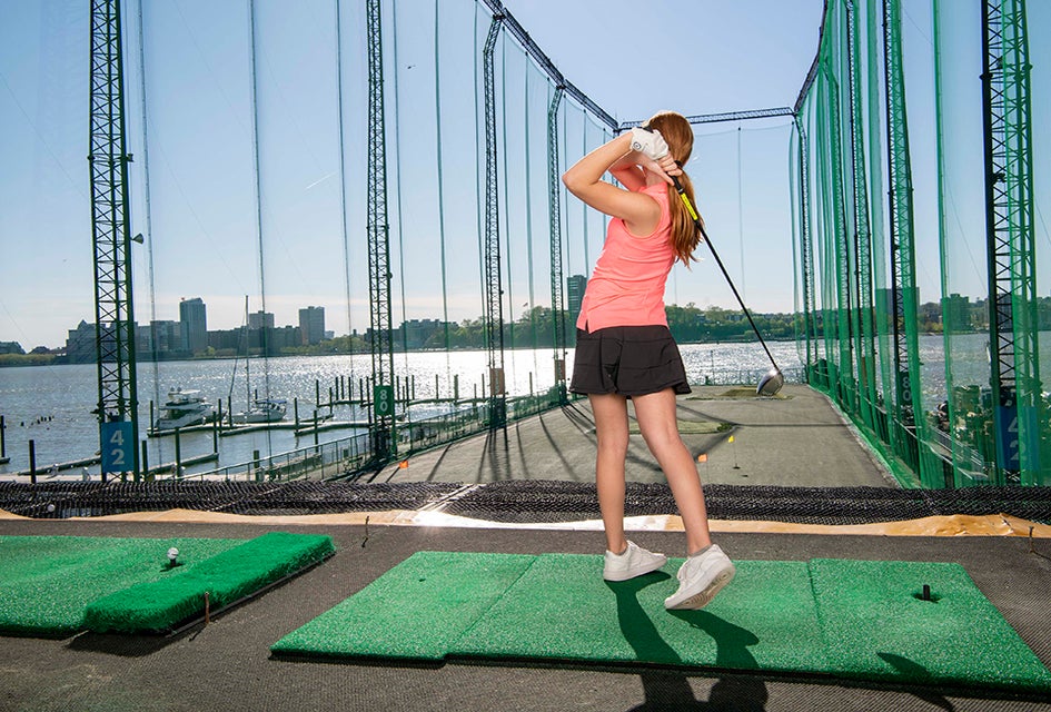 Swing into action with a golf summer camp at Chelsea Piers. Photo courtesy of Chelsea Piers