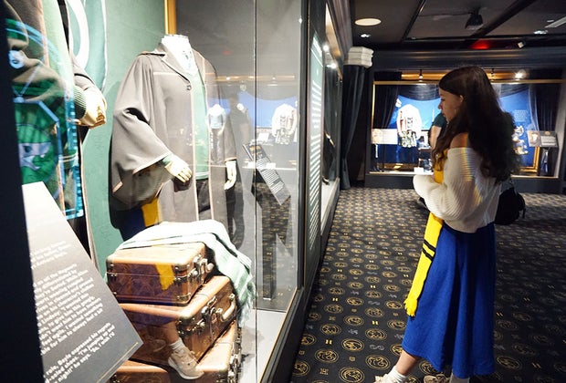 Harry Potter: The Exhibition: Looking at costumes in a gallery