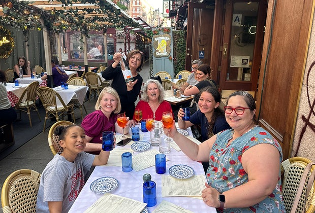 Best Little Italy Restaurants Family eating enjoying a Italian meal outdoors little Italy nyc