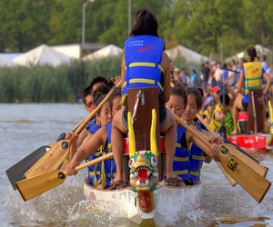 See teams set sail during the Hong Kong Dragon Boat Festival in Flushing Meadows Corona Park. Photo by Bob Dea